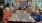 people sitting around a table posing for a picture