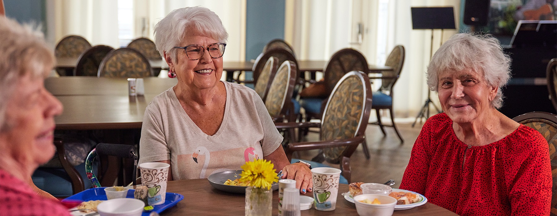 three women sitting at a table