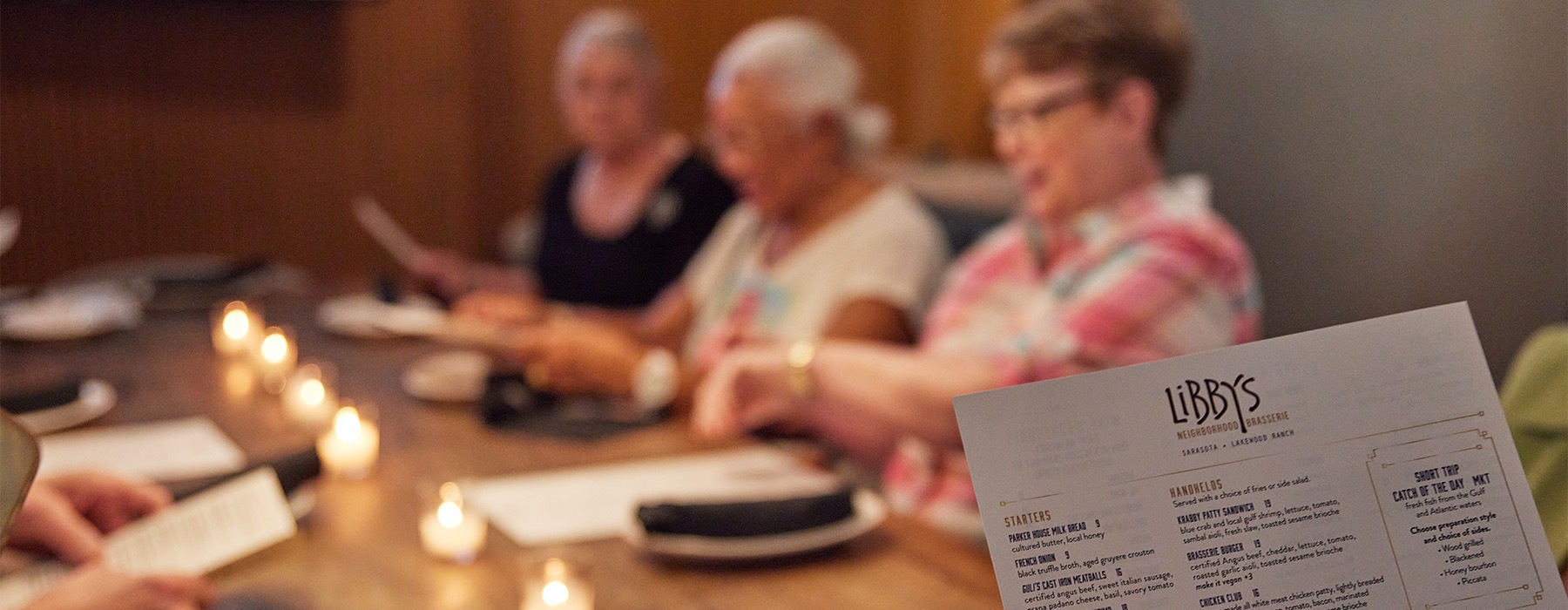 friends sit together at a nearby restaurant