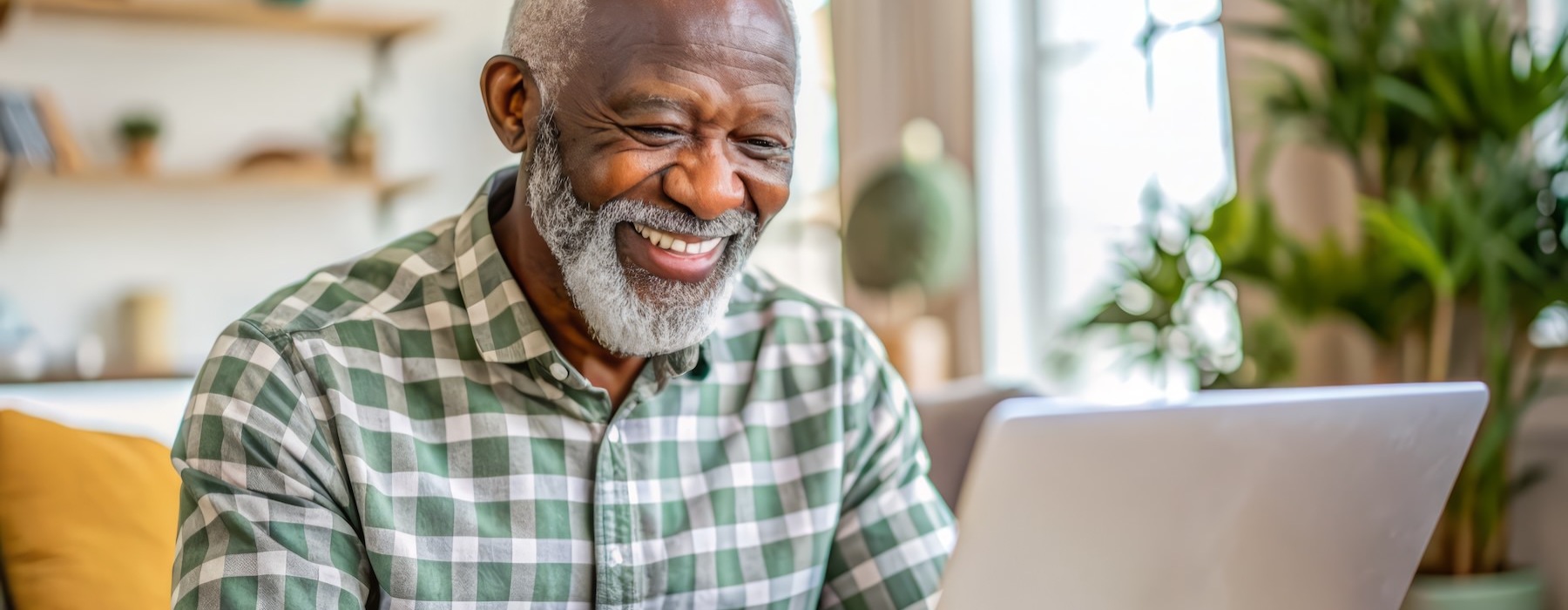 a man looking at a laptop